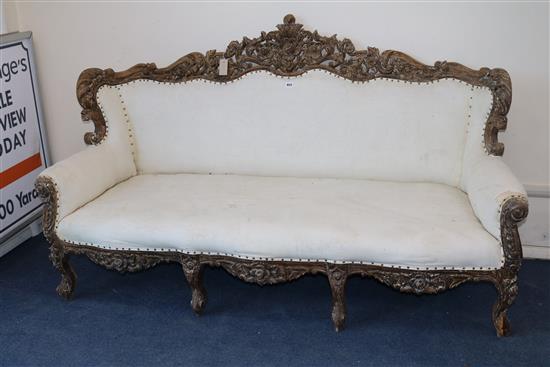 An late 19th century carved walnut settee 186cm